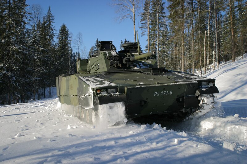 Military tank in snowy forest
