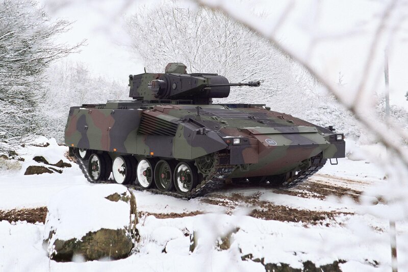 Military tank in snowy forest
