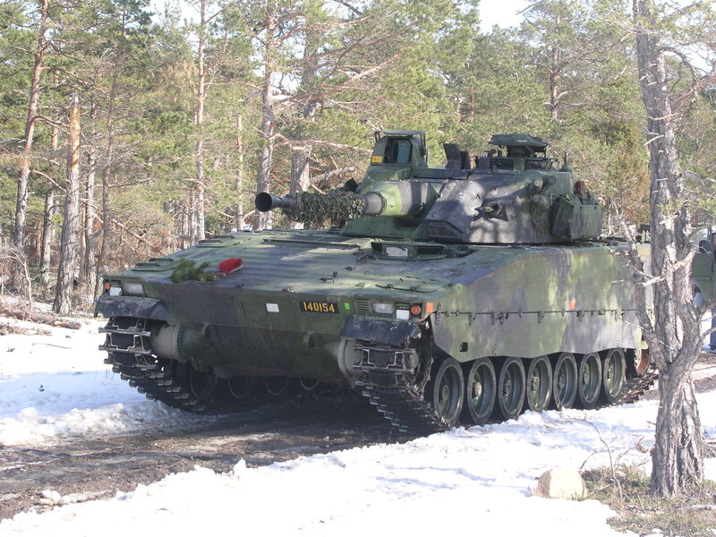 Military tank in snowy forest