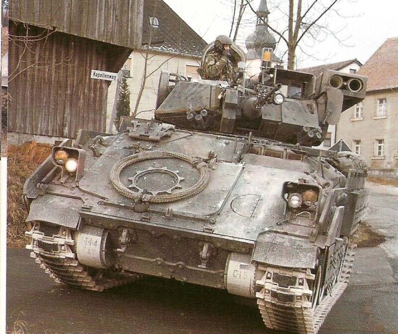 Military tank in village street