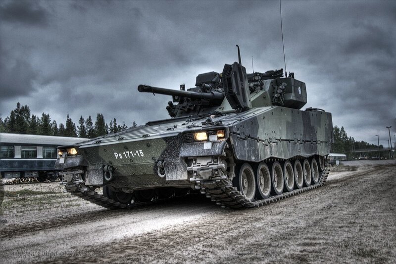 Military tank on dirt road