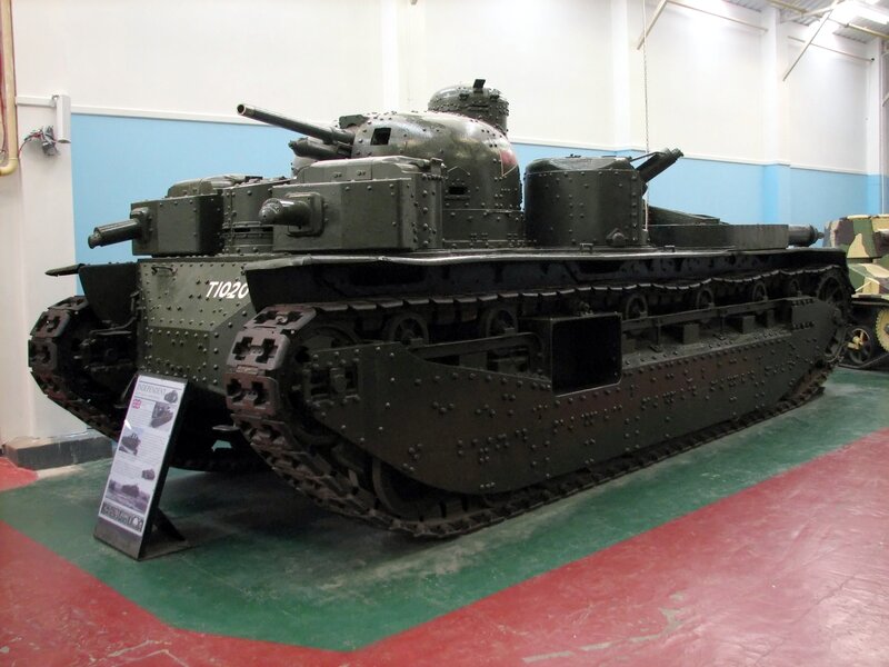Military Tank on Display — Green, Neutral, Photograph, Informational Sign