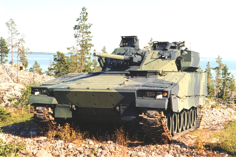 Military tank on rocky terrain