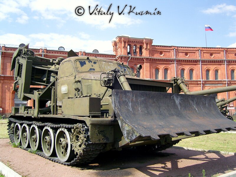 Military tank with bulldozer blade