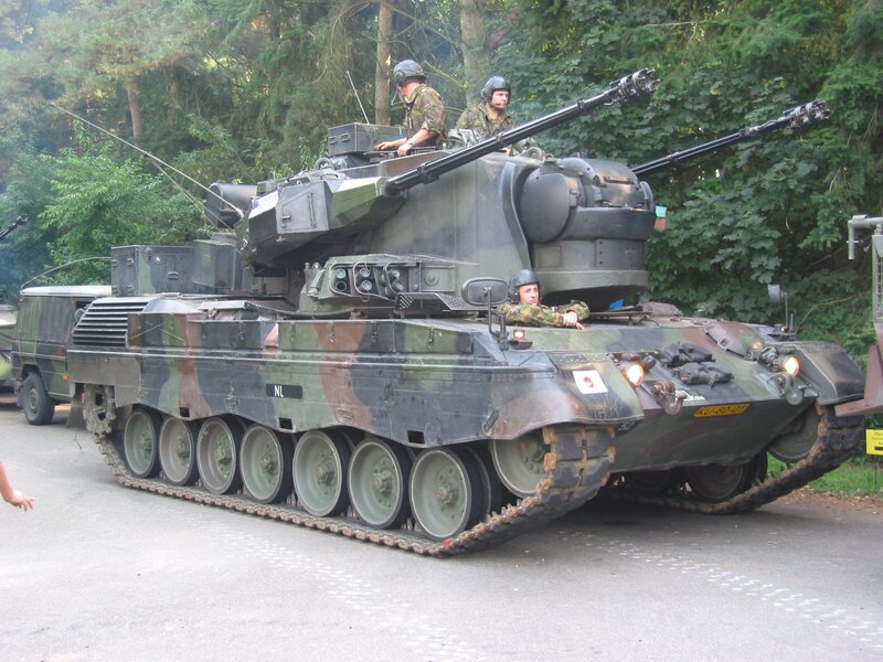 Military tank with soldiers