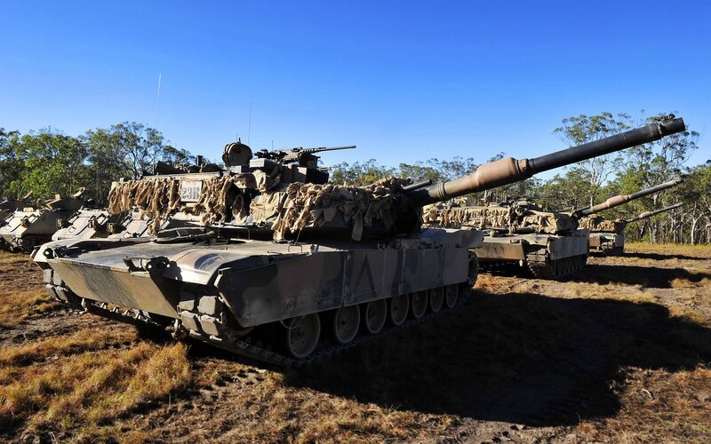 Military tanks in a field