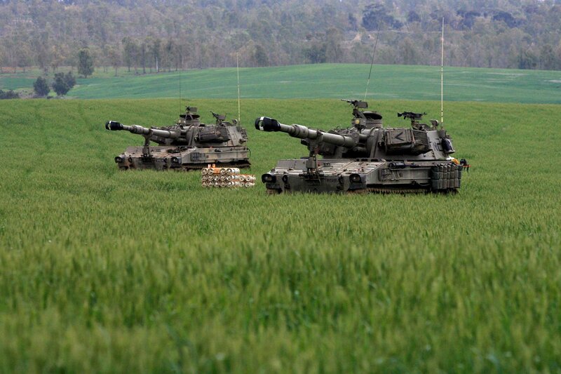 Military tanks in a field