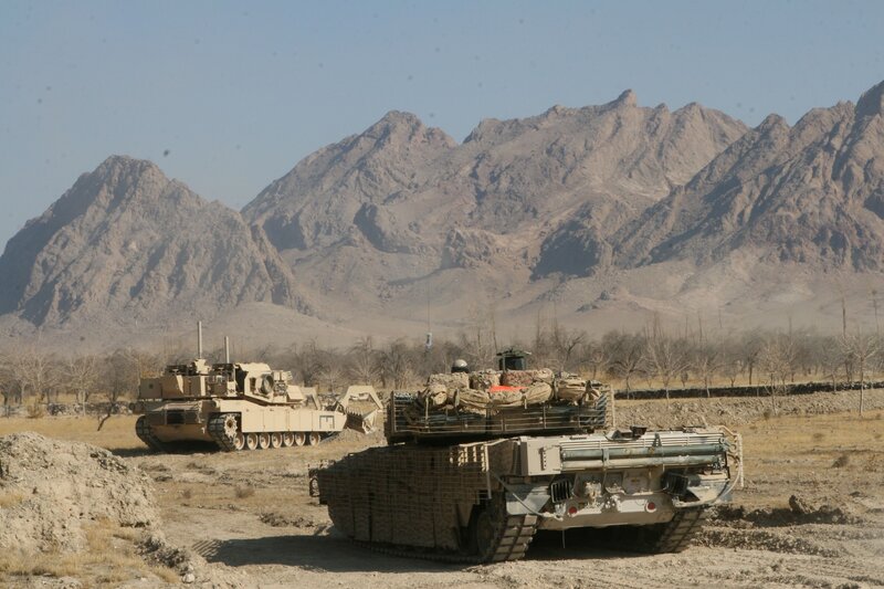 Military tanks in mountainous terrain