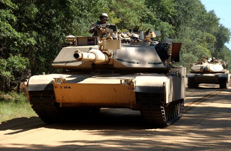 Military tanks on a dirt road