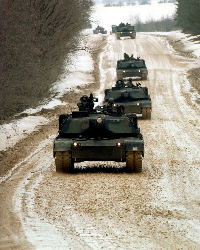 Military tanks on a snowy road