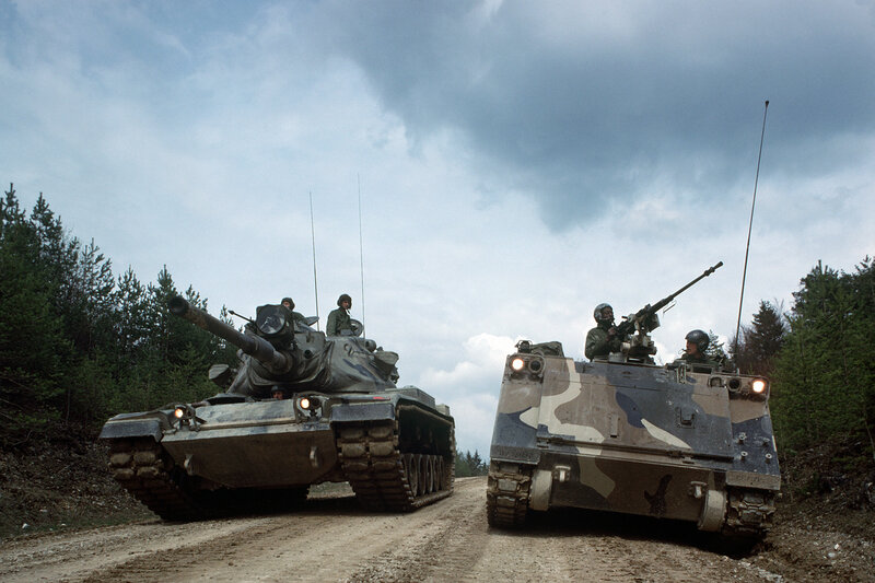 Military tanks on dirt road