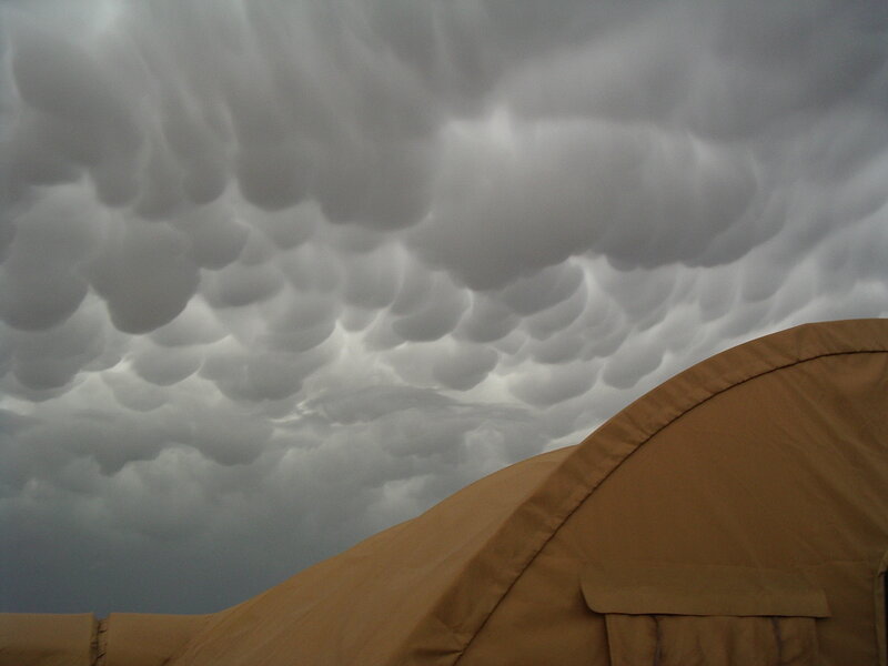 Military Tent under Storm Clouds