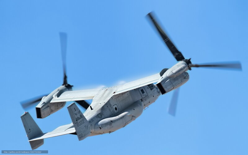 Military tiltrotor aircraft in flight