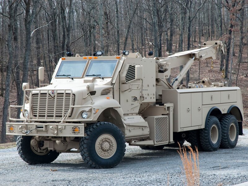 Military tow truck in forest