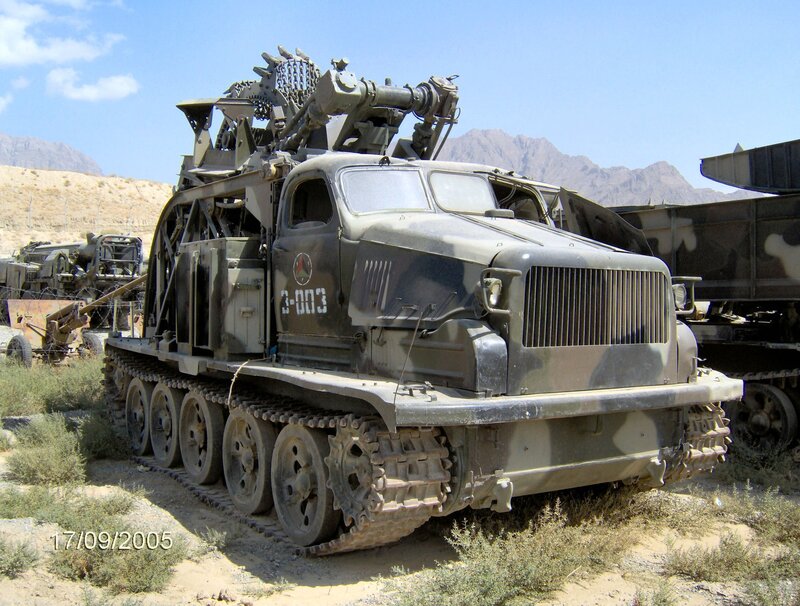 Military tracked vehicle in desert