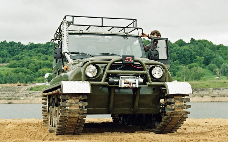 Military tracked vehicle on beach