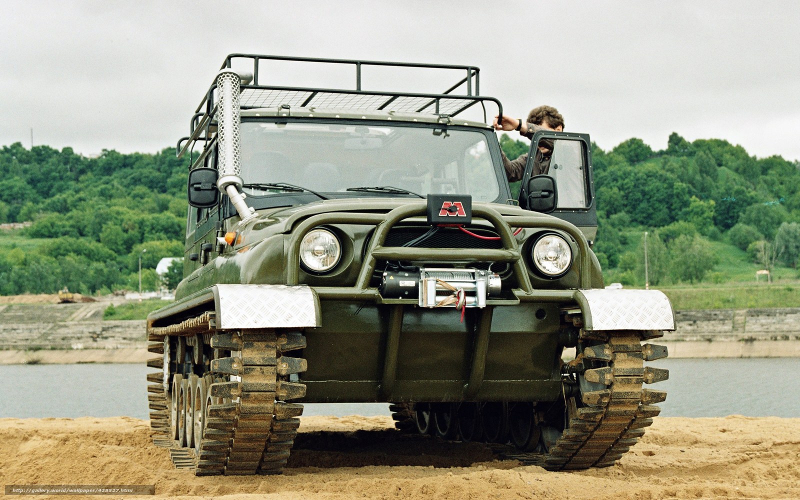Military tracked vehicle on beach