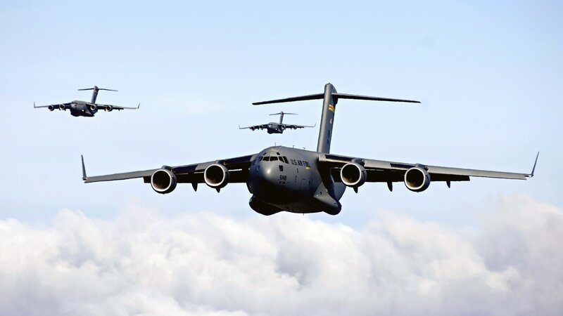 Military transport aircraft in formation