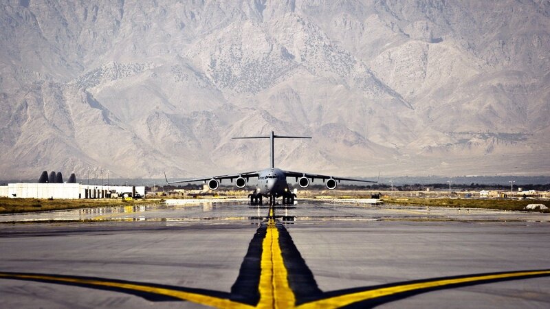 Military Transport Plane — Gray, Dramatic, Afternoon, Photograph, Mountains, Runway