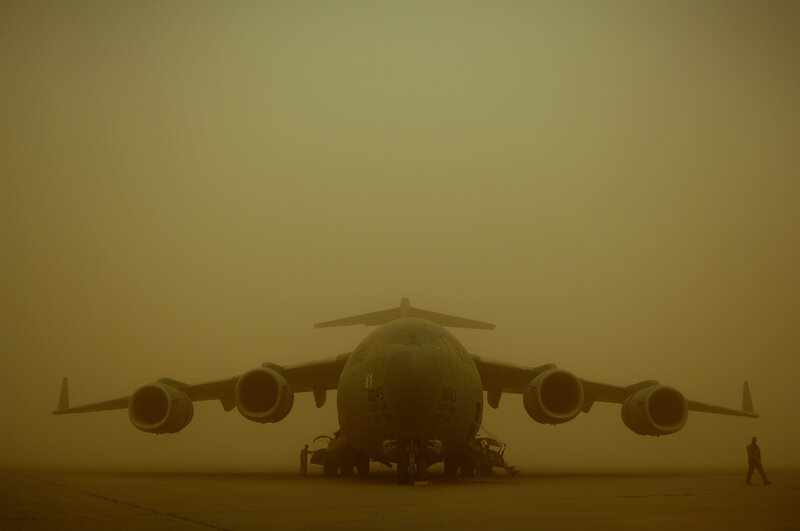 Military transport plane in sandstorm