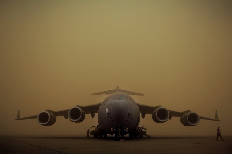 Military transport plane in sandstorm
