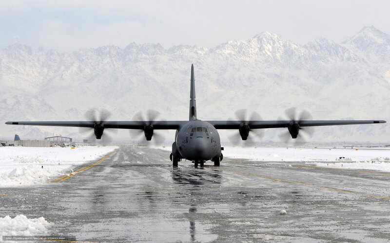 Military transport plane on snowy runway