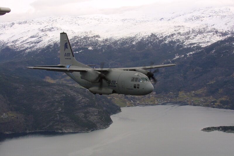 military transport plane over fjord