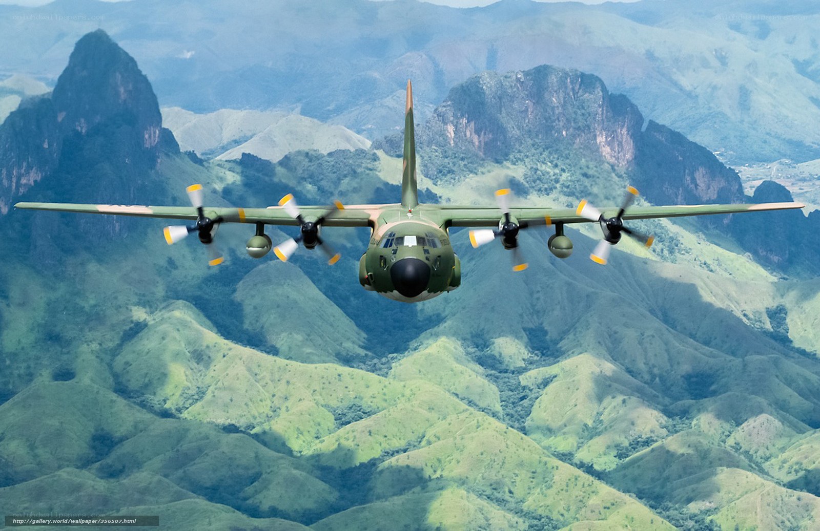 military transport plane over mountains