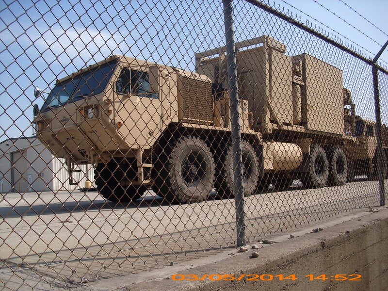 Military Truck Behind Fence