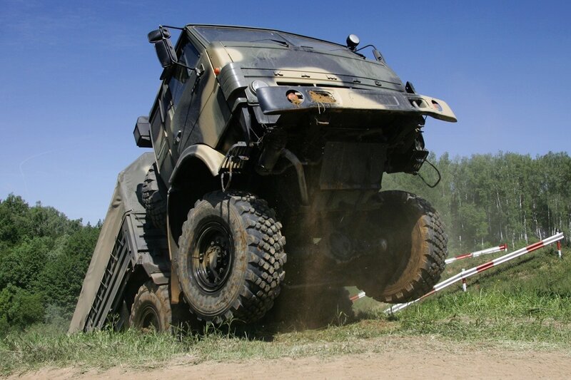 Military truck climbing obstacle