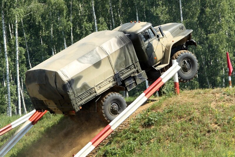 Military truck climbing obstacle