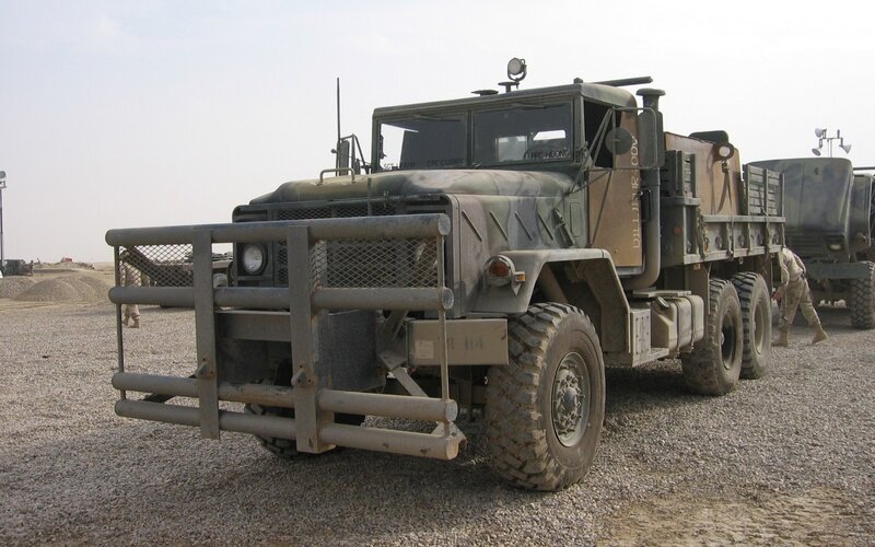 Military truck in desert environment