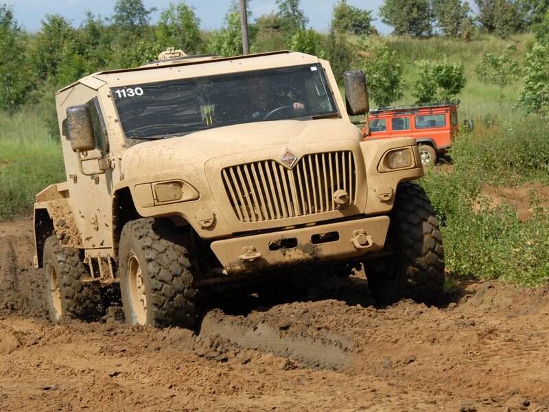 Military truck in muddy terrain