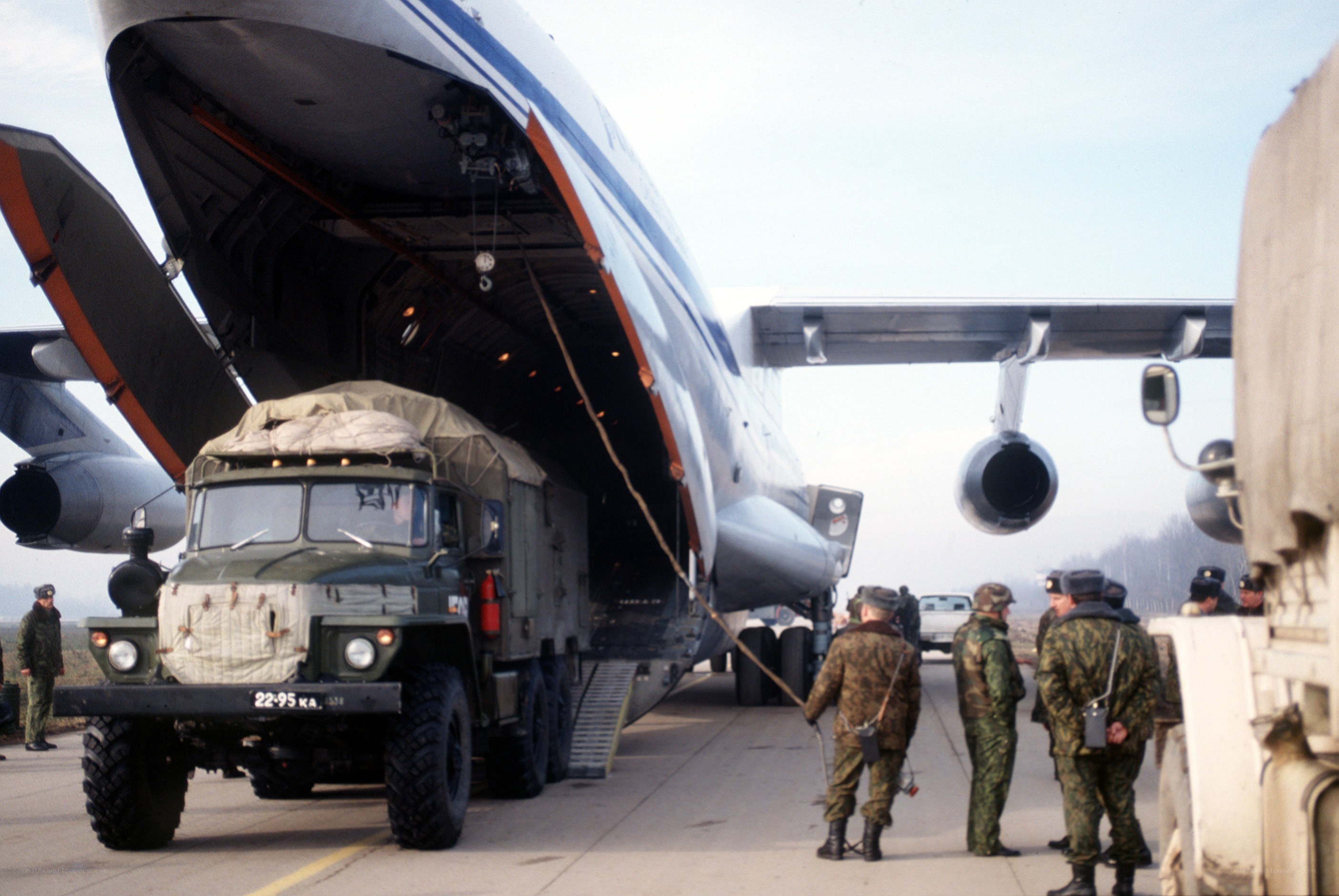 Military truck loading into aircraft