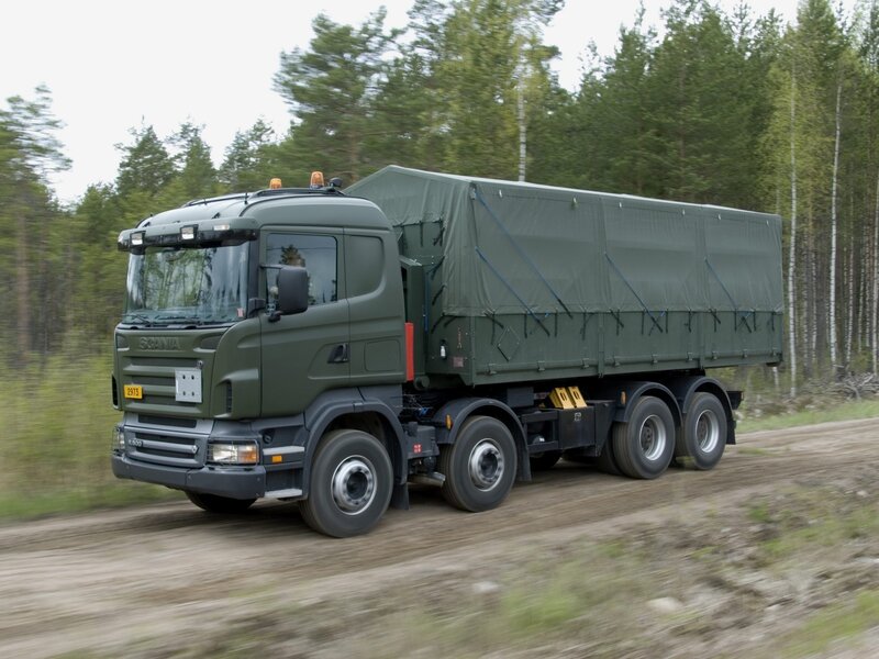 Military truck on dirt road