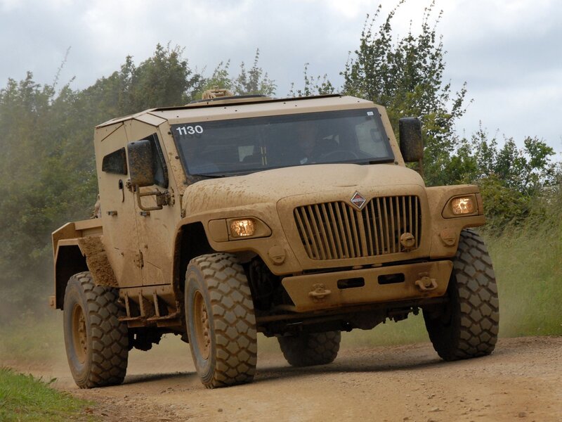 Military truck on dirt road