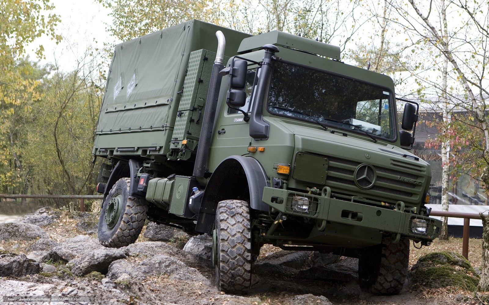 Military truck on rocky terrain