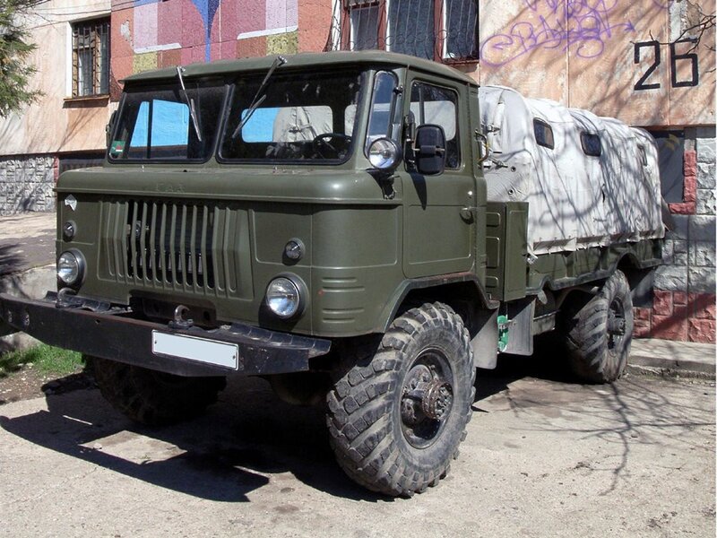 Military truck parked on street