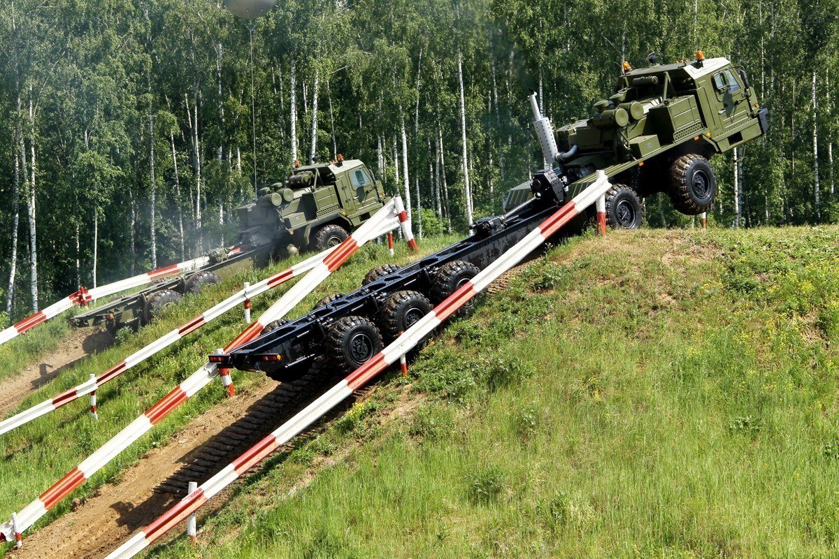 Military trucks on obstacle course