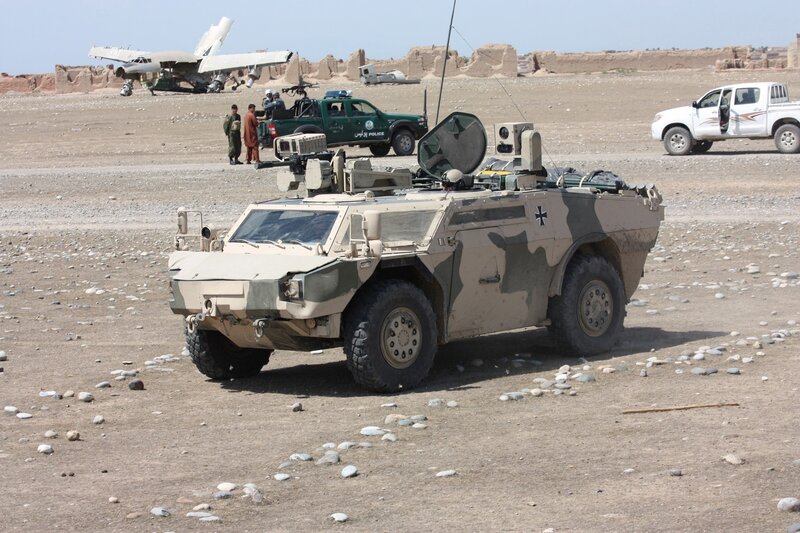 Military vehicle at desert base