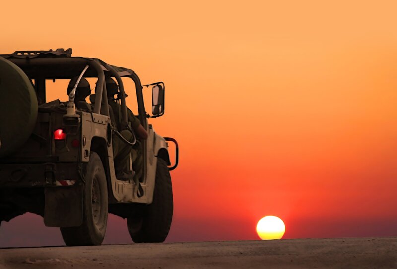 Military Vehicle at Sunset — Orange