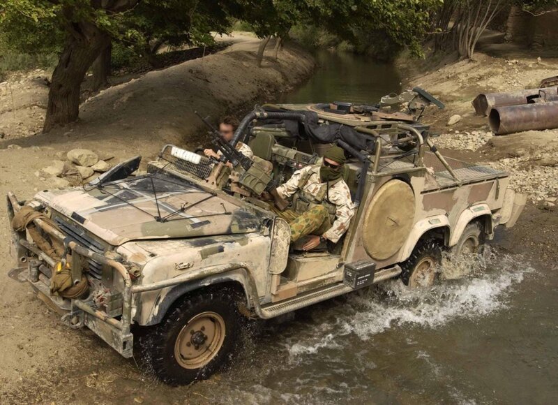 Military vehicle crossing river