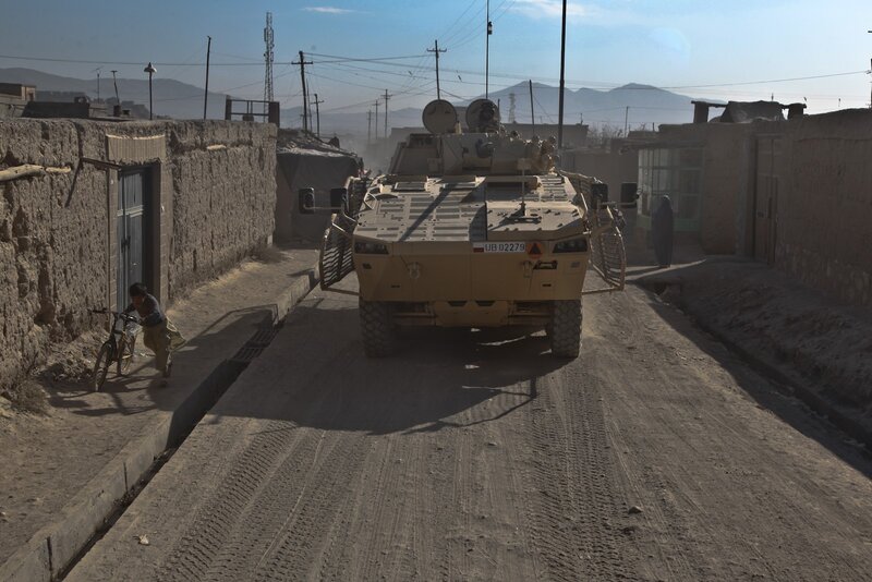 Military vehicle in Afghan street