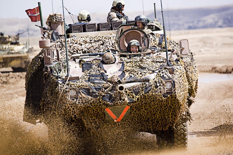 Military vehicle in desert terrain