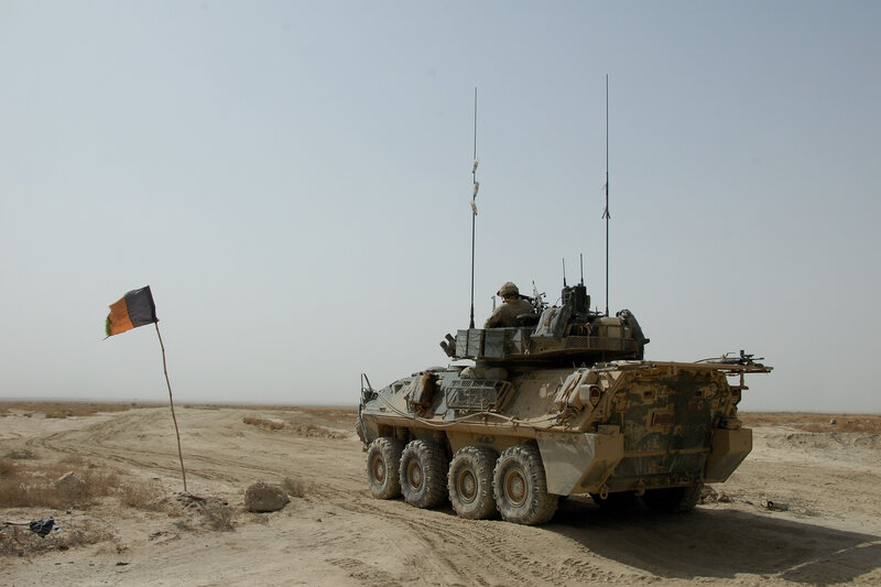 Military vehicle in desert terrain