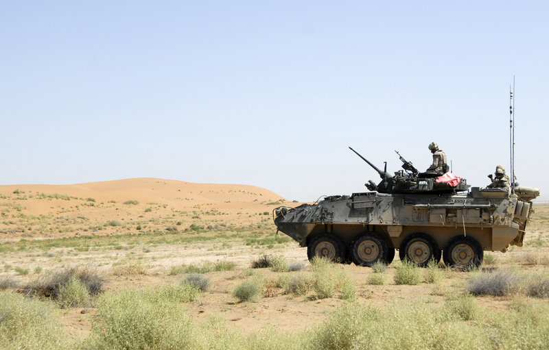 Military vehicle in desert terrain