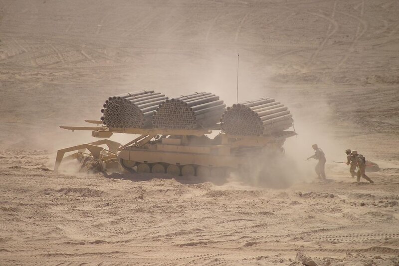 Military vehicle in desert terrain