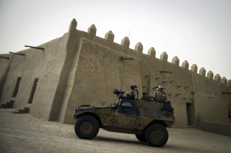 Military vehicle in desert town
