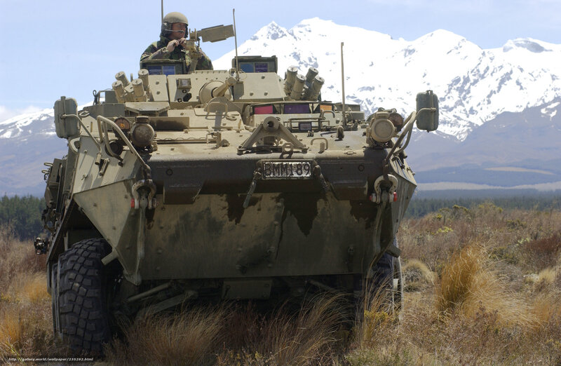Military vehicle in mountainous terrain
