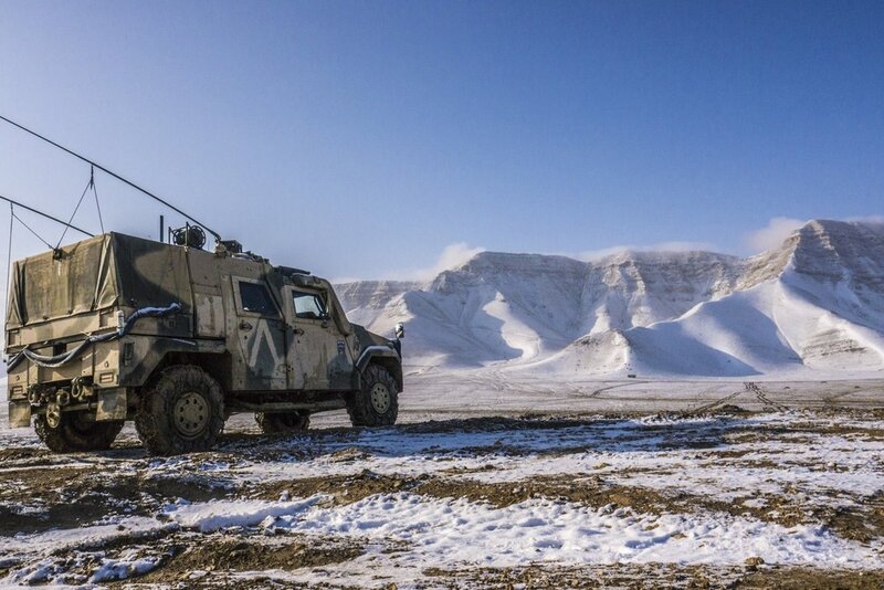 Military vehicle in snowy mountains